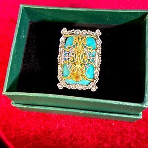 Beautiful cocktail ring with synthetic turquoise and white zircons